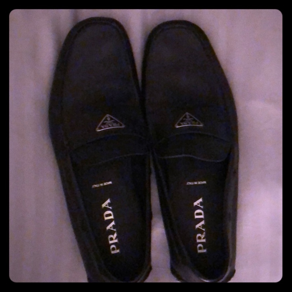 Prada loafers.
